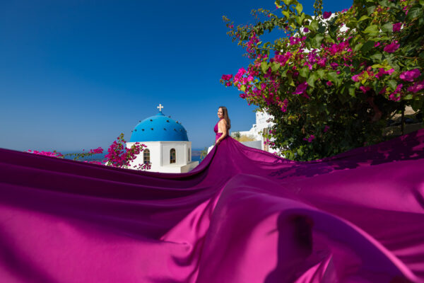 Magenta flying dress photoshoot in Santorini